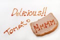 Delicious sign with ketchup and mmmm on the bread with pate Royalty Free Stock Photo