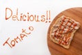 Delicious sign with ketchup and mmmm on the bread with pate Royalty Free Stock Photo