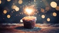 Delicious single chocolate cupcake with sparkler and hearts bokeh on enchanting magical background Royalty Free Stock Photo