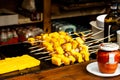 Delicious skewers of polenta and sausage cooked on the grill in a fast food restaurant