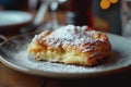 Delicious slice of apple pie on a plate with powdered sugar