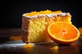 Delicious slice of orange cake on dark background