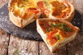 Delicious sliced pie with feta cheese, tomatoes and herbs closeup. horizontal Royalty Free Stock Photo