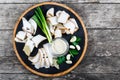 Delicious sliced pork fat with spices, green onions, garlic and sauce on cutting board on wooden background close up Royalty Free Stock Photo