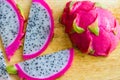 Delicious slices of pitaya fruit on top of wood