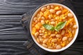 Delicious slow-stewed beans with corn, pumpkin and onions close-up in a bowl. horizontal top view