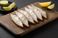 Delicious smoked halibut slices served in gray plate.