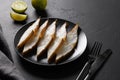 Delicious smoked halibut slices served in black plate