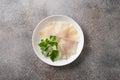 Delicious smoked halibut slices served in white plate. Royalty Free Stock Photo