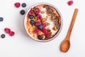 Delicious smoothie bowl with berries and dryed coconut.