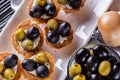 Delicious snack tartlets on rustic wooden background