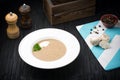 Delicious soup puree with mushrooms on black background Royalty Free Stock Photo