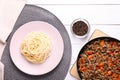 Delicious spaghetti, minced meat with carrot and pepper on white wooden table, flat lay Royalty Free Stock Photo