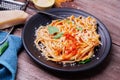 Delicious spaghetti pasta with prawns and cheese served in a black bowl on a black background table Italian recipe, tomato sauce, Royalty Free Stock Photo