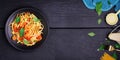 Delicious spaghetti pasta with prawns and cheese served on a black plate on a black background table Italian recipe, tomato sauce Royalty Free Stock Photo