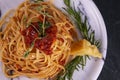 Delicious spaghetti served with parmesan cheese on a marble plate. Royalty Free Stock Photo