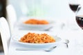 Delicious spaghetti with tomatoe sauce served on a white plate on the kitchen at home Royalty Free Stock Photo