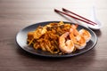 A delicious spicy fried flat rice noodle also know as