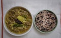 Spicy Korean Beef Stew called Yukgaejang and cooked rice with Red Beans called Patbap. Served side by side on white table cloth wi Royalty Free Stock Photo