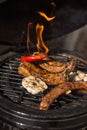 Delicious spicy marinated spare ribs on hot flaming grill. Barbecue. Restaurant Royalty Free Stock Photo