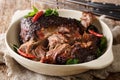 Delicious spicy slow shredded pulled pork closeup on a plate. horizontal