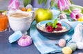 Delicious spring breakfast on a gray stone background. A bouquet of fresh tulips of pink and mint color. Small and large colored Royalty Free Stock Photo