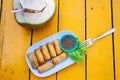 delicious spring rolls on a yellow table - happy meal Royalty Free Stock Photo