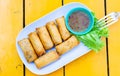 delicious spring rolls on a yellow table - happy meal