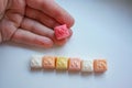 Delicious square bright candy with smile on white background