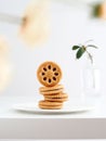 Delicious stack of cookies placed on a white plate atop a table