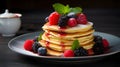 delicious stack of freshly made pancakes with berries.