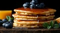 Delicious stack of golden pancakes topped with fresh blueberries and syrup Royalty Free Stock Photo