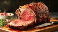 Delicious standing rib roasted with cut off slice on wood cutting board. Holiday meal for family dinner celebrations