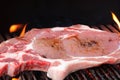 A delicious steak is prepared on the grill grate. Grilled beef fillet. Background with place for text