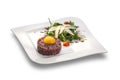 Delicious Steak tartar with yolk and rocket salad