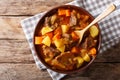 delicious stew estofado with beef and vegetables close-up. Horizontal top view Royalty Free Stock Photo