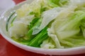 The delicious stir fried cabbage on white plate at Taiwanese restaurant.