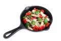 Delicious Stir fried pork with sweet peppers, onion and black pepper on black pan.