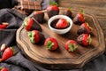 Delicious strawberries covered with chocolate on wooden board Royalty Free Stock Photo