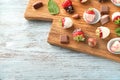 Delicious strawberries covered with chocolate on wooden board Royalty Free Stock Photo