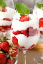 Delicious strawberries with whipped cream in glass, closeup Royalty Free Stock Photo