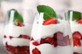 Delicious strawberries with whipped cream in glass, closeup. Space for text Royalty Free Stock Photo