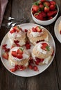 Pastry with strawberries. Traditional strawberry shortcake. Served on wooden table from above. Royalty Free Stock Photo