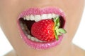 Delicious strawberry fruit in woman mouth Royalty Free Stock Photo
