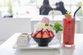 Delicious strawberry ice cream scoop with fresh strawberries on table background Royalty Free Stock Photo