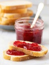 Delicious strawberry jam spread on freshly toasted bread slices Royalty Free Stock Photo
