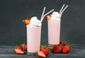 Delicious strawberry milkshake decorated with whipped cream Royalty Free Stock Photo