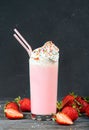 Delicious strawberry milkshake decorated with whipped cream Royalty Free Stock Photo