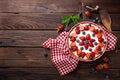 Delicious strawberry pie with fresh blueberry and whipped cream on wooden rustic table, cheesecake Royalty Free Stock Photo