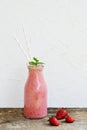 Delicious strawberry smoothie with milk, ice cream, green mint Royalty Free Stock Photo